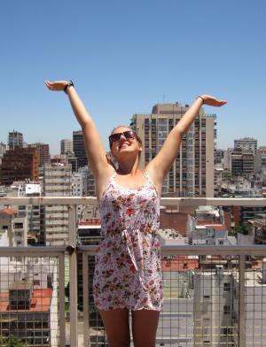 a student poses for a fun photo at the top of a building in Buenos Aires