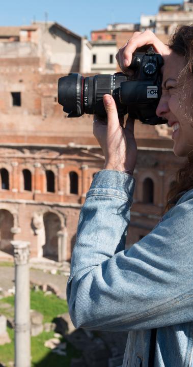 a student takes a photo of the Roman Forum in Rome